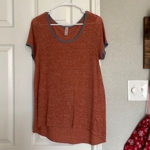 Burnt orange with blue outlined caller and sleeves